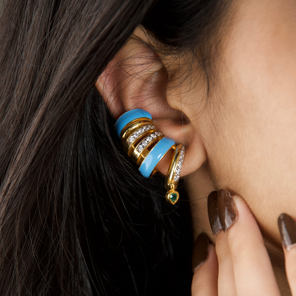 Capri Ear Cuffs — blue enamel gold ear cuff with emerald heart drop, worn on ear