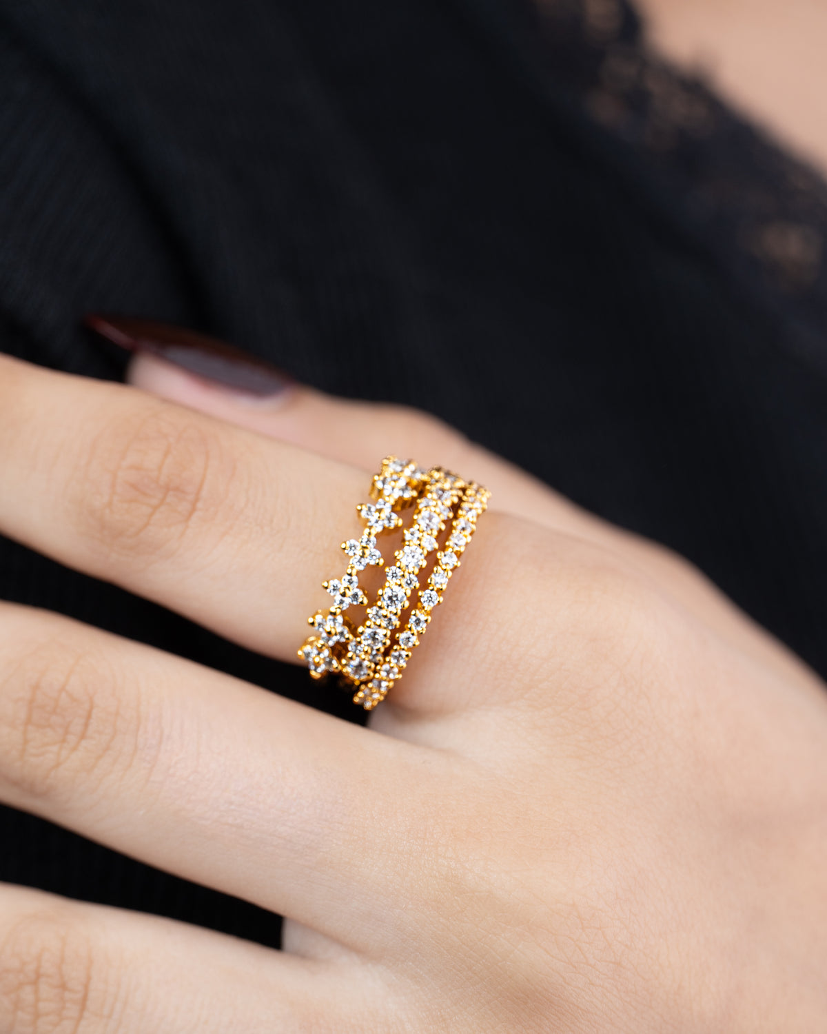 Stacked — set of three 21k gold-plated pavé stacking rings worn on hand