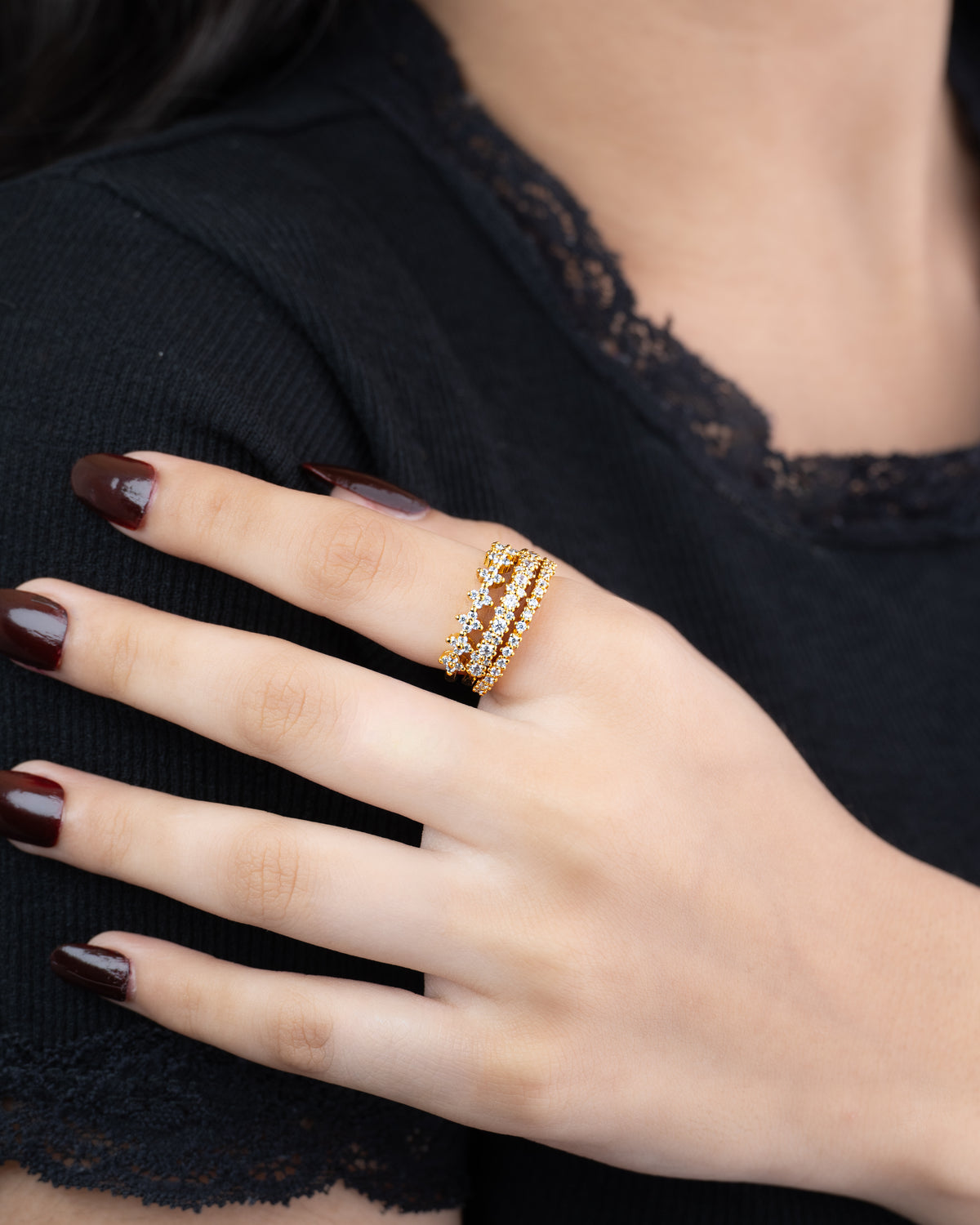 Stacked — set of three 21k gold-plated pavé stacking rings worn on hand