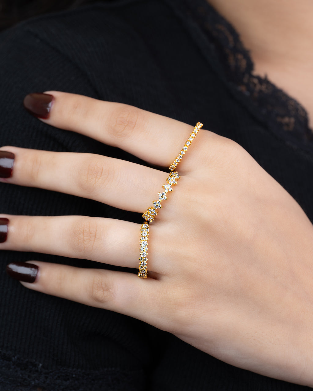 Stacked — set of three 21k gold-plated pavé stacking rings worn on hand