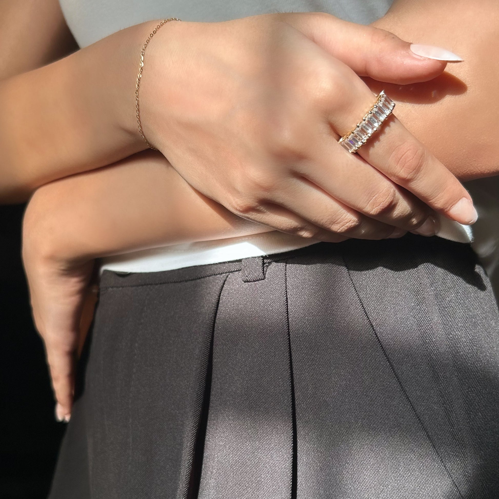 Close-up of a person wearing a ring with a blurred background