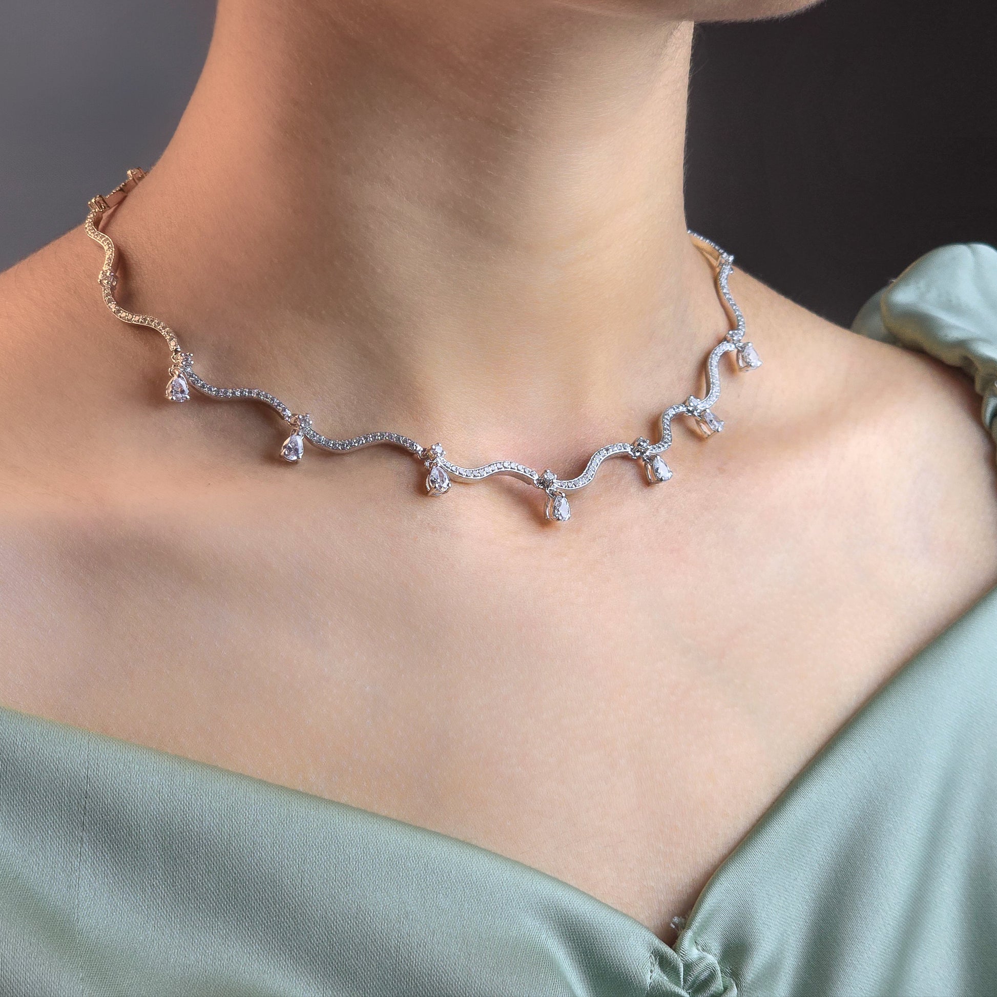 Necklace worn by a person with a blurred background