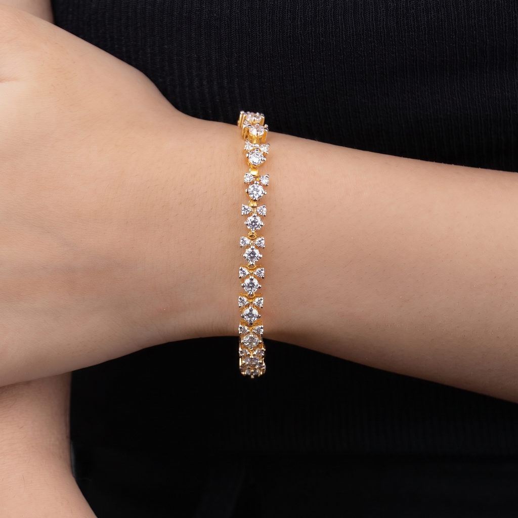 Fizza gold cluster bracelet worn on wrist