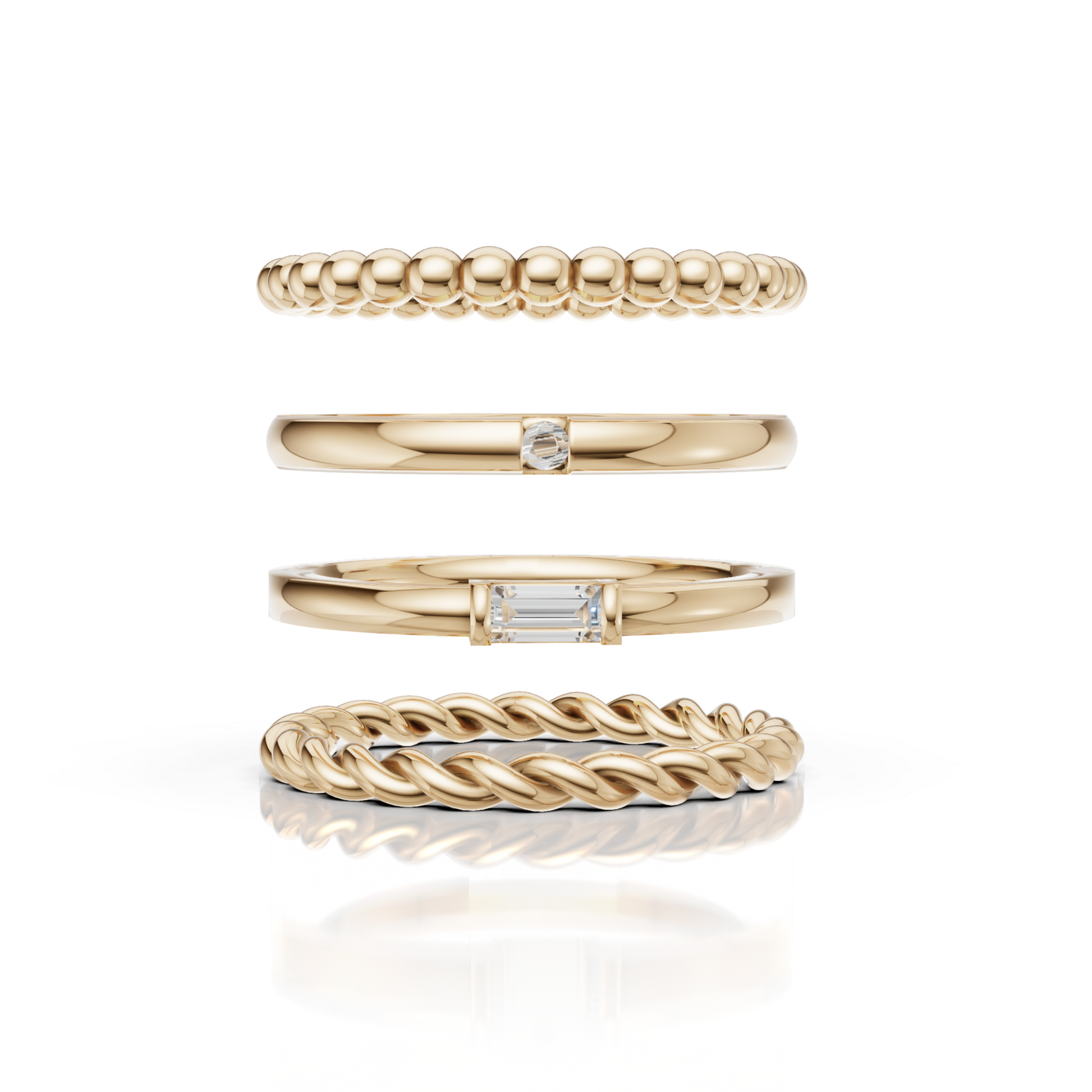 Set of four gold rings with different designs on a white background