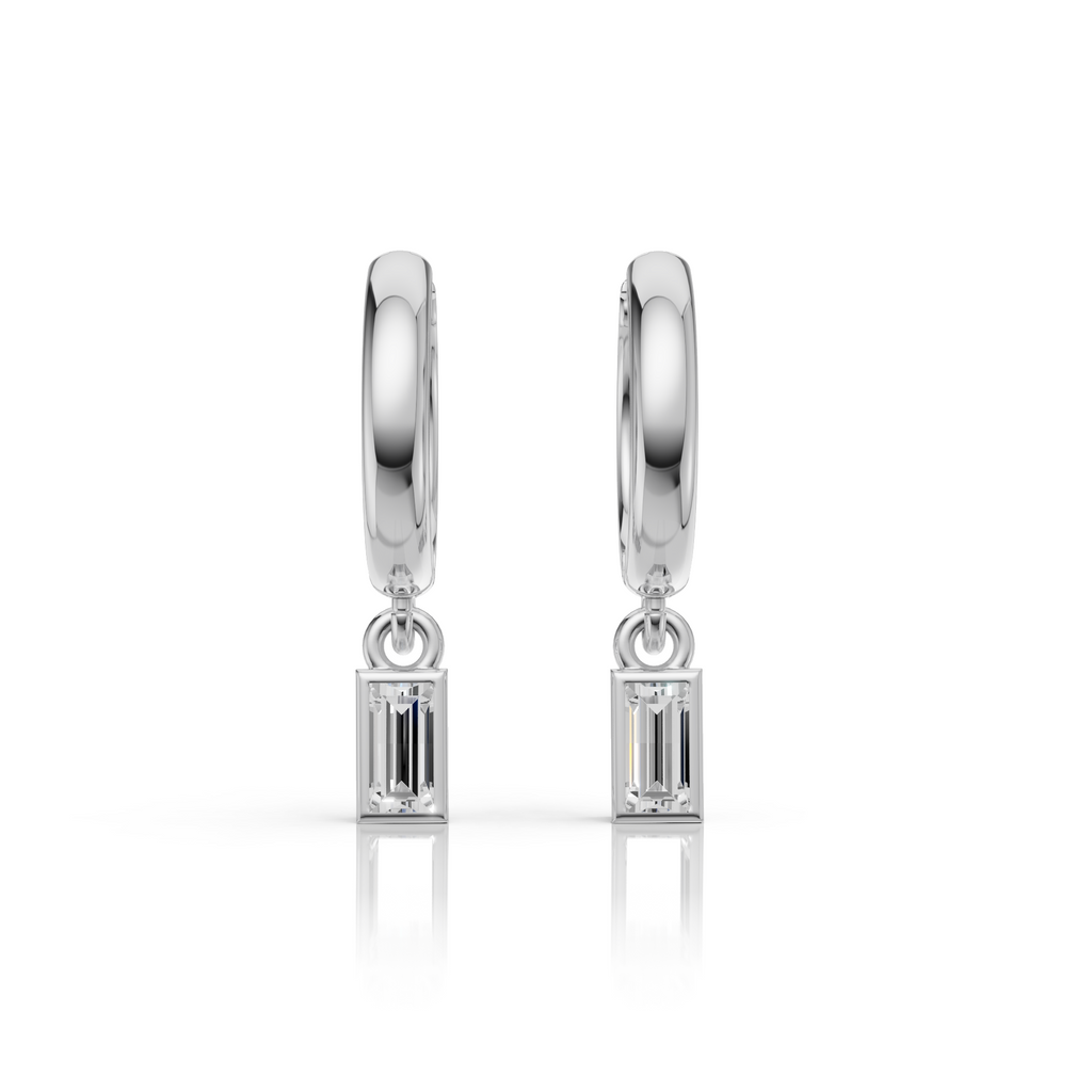 Pair of silver hoop earrings with baguette gemstones on a white background