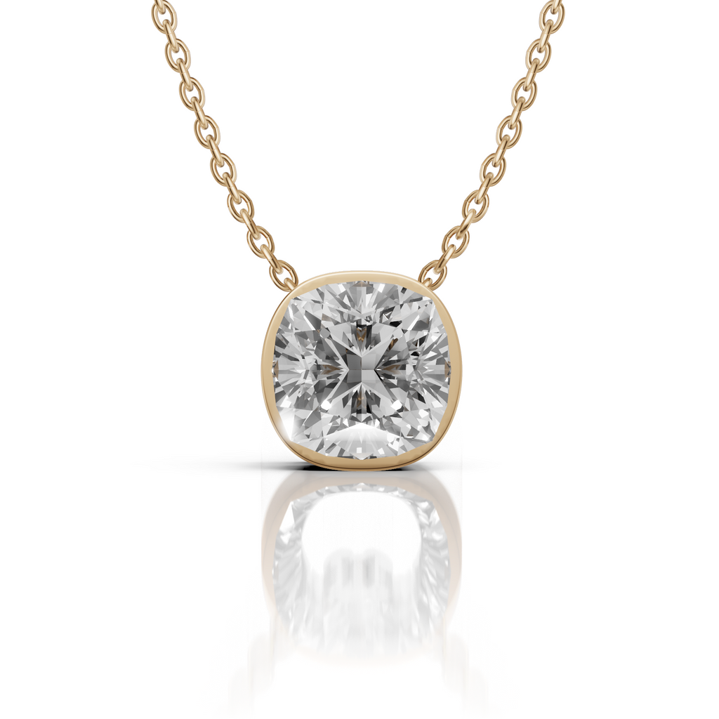 Gold necklace with a round diamond pendant on a white background