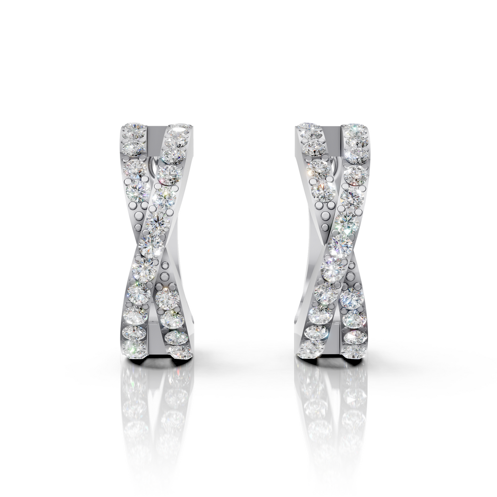Pair of silver earrings with diamond-like stones on a white background
