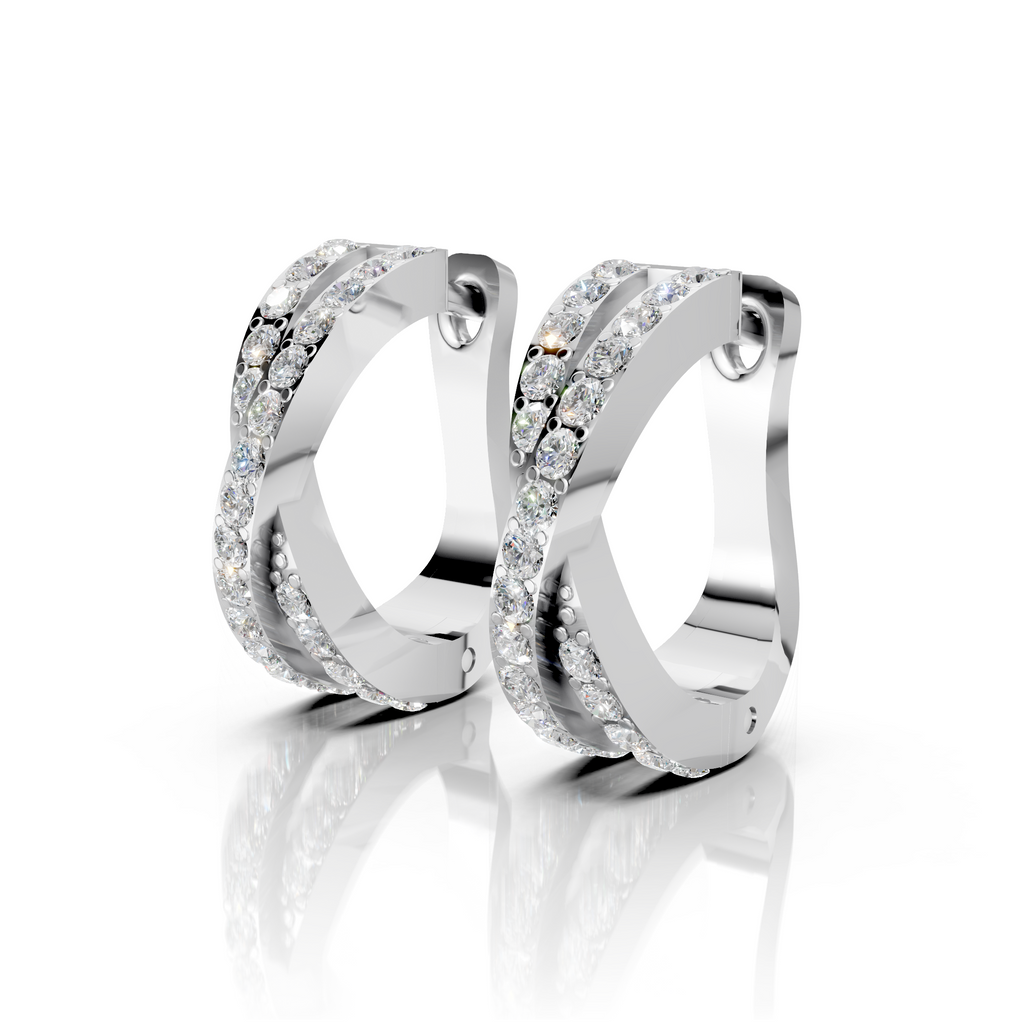 Pair of silver hoop earrings with clear gemstones on a white background