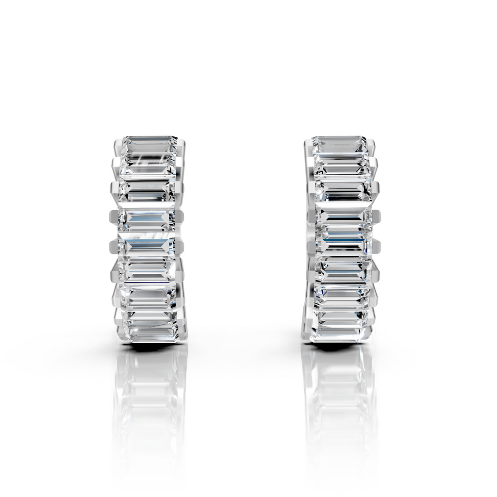 Pair of emerald cut earrings on a white background
