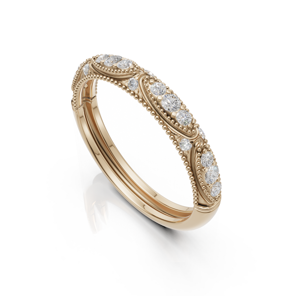 milgrain gold ring with diamonds on a white background